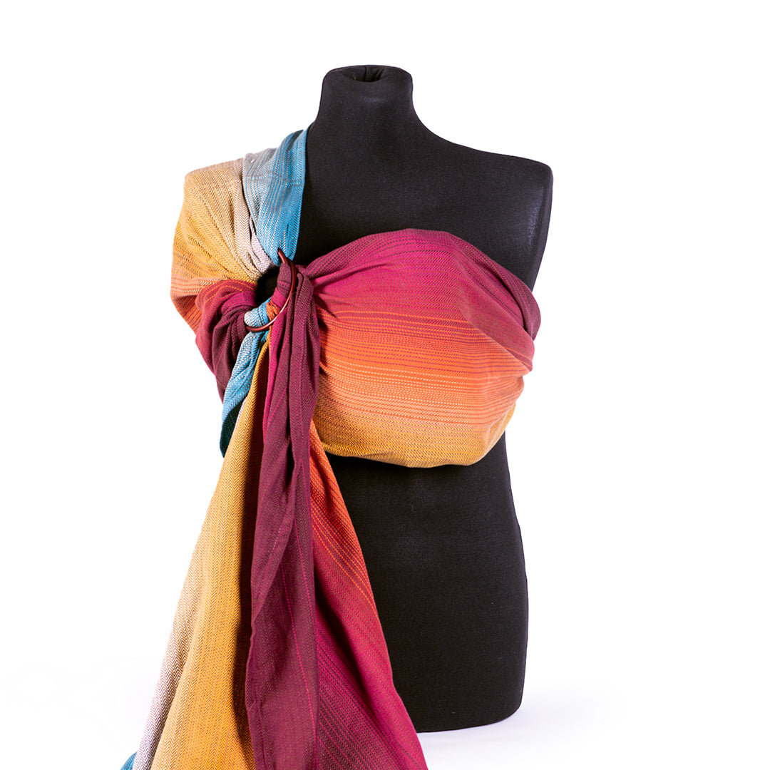 Ringsling Solstice Fire an Tragepuppe